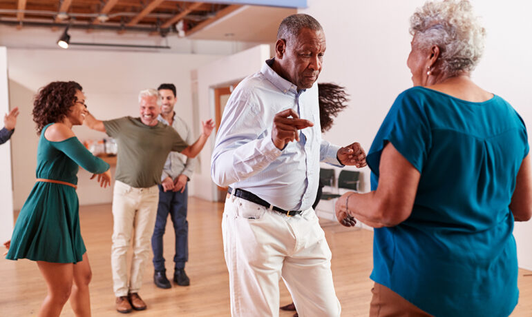 People Attending Dance Class In Community Center