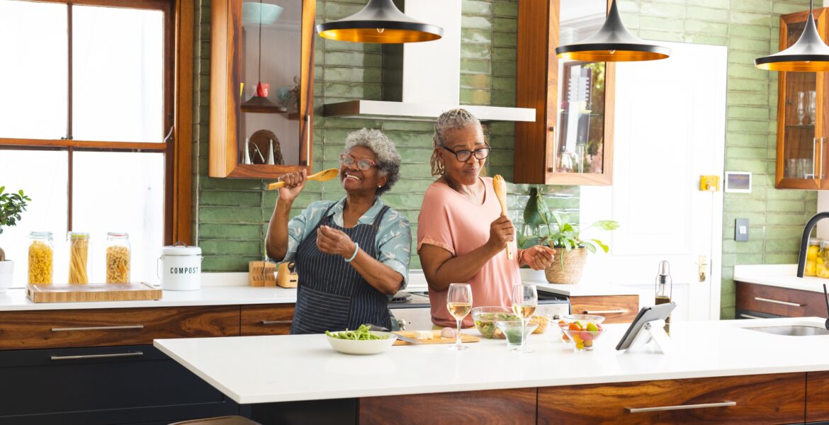 Senior,African,American,Woman,And,Senior,Biracial,Woman,Are,Cooking
