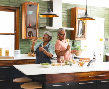 Senior,African,American,Woman,And,Senior,Biracial,Woman,Are,Cooking